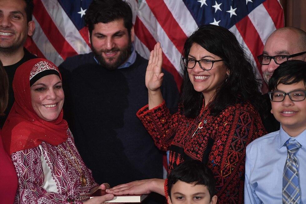 Rashida Tlaib taking the oath of office on a Quran