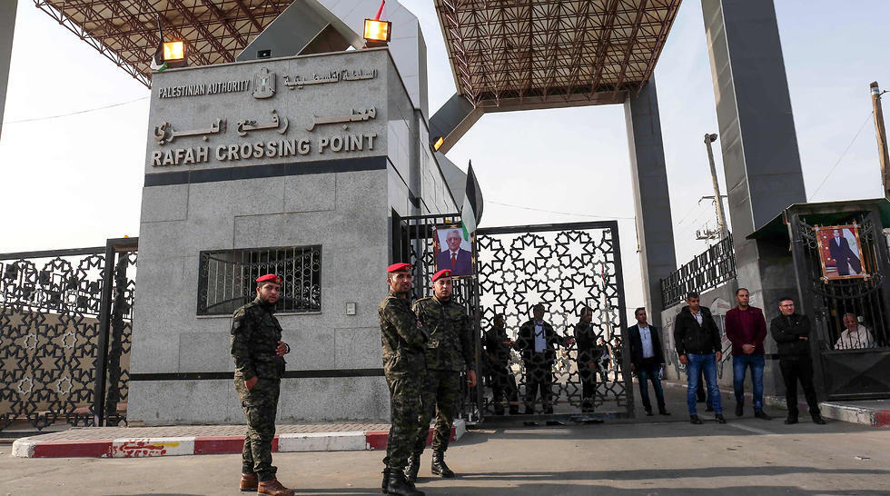 Hamas security forces at Rafah border crossing, where portraits of Abbas and Egyptian President al-Sisi are featured prominently. (Photo: AFP) Hamas security forces at Rafah border crossing, where portraits of Abbas and Egyptian President al-Sisi are featured prominently.