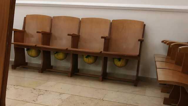 Helmets under the seats at Beth Israel synagogue