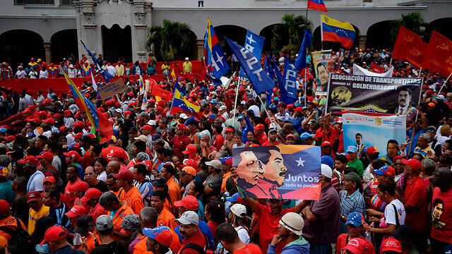 Демонстрация в Каракасе. Фото: AFP (צילום: AFP) Демонстрация в Каракасе. Фото: AFP