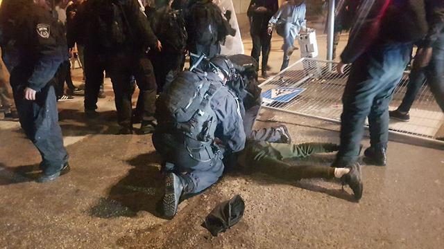 Police arrest one of the rioters