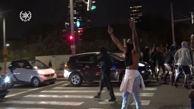 Dozens of protesters riot