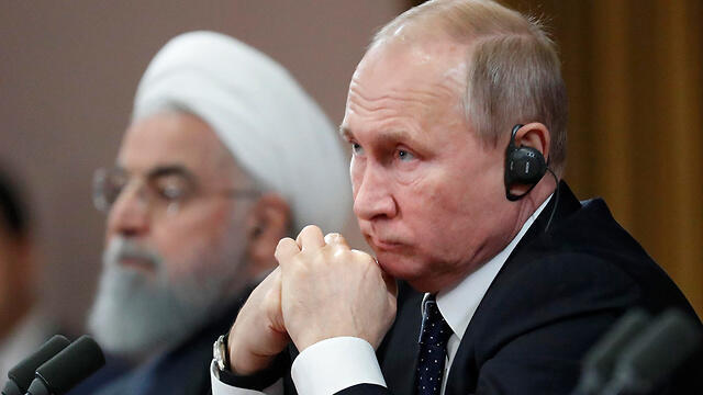 Russia's Vladimir Putin and Iran's Hassan Rouhani
