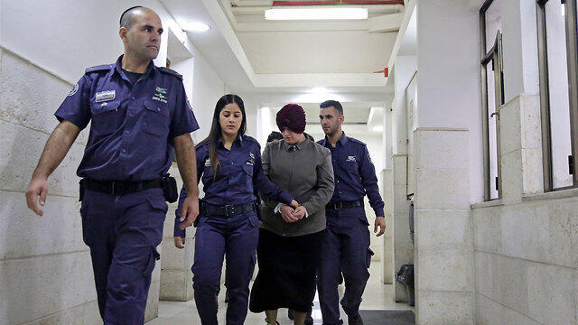 Police escorting Malka Leifer at a previous court appearance