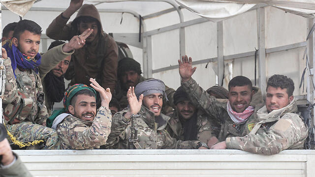 Kurish fighters in Syria celebrate victory over Islamic State (צילום: MCT) Kurish fighters in Syria celebrate victory over Islamic State