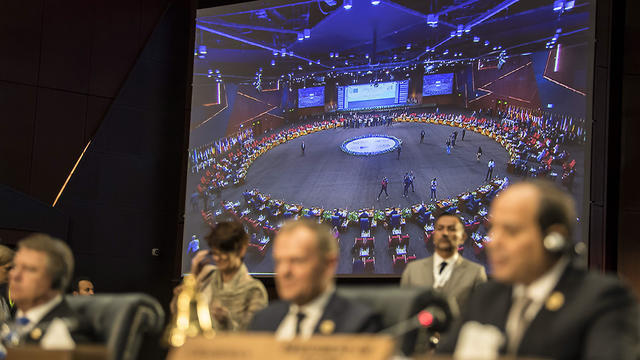A big screen shows the venue of the first joint European Union and Arab League summit behind Egyptian President Abdel Fattah al-Sisi (R) and European Council President Donald Tusk (C) during the final session of the meeting in the Egyptian Red Sea resort of Sharm el-Sheikh (Photo: AFP) A big screen shows the venue of the first joint European Union and Arab League summit behind Egyptian President Abdel Fattah al-Sisi (R) and European Council President Donald Tusk (C) during the final session of the meeting in the Egyptian Red Sea resort of Sharm el-Sheikh