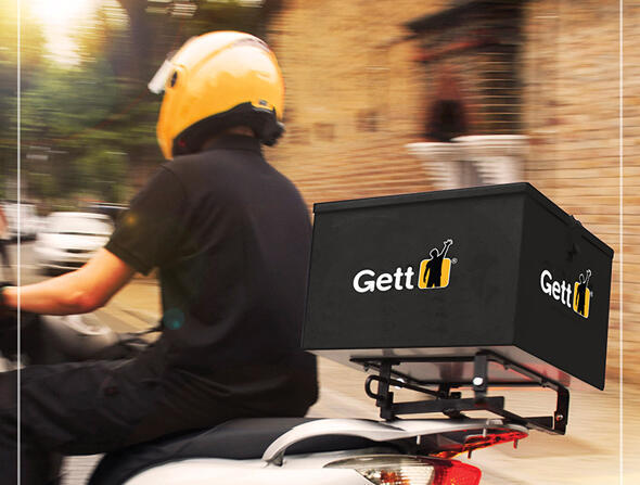 Курьер, работающий с аппликацией Gett Delivery. Фото: Gett (Фото: Gett) Курьер, работающий с аппликацией Gett Delivery. Фото: Gett