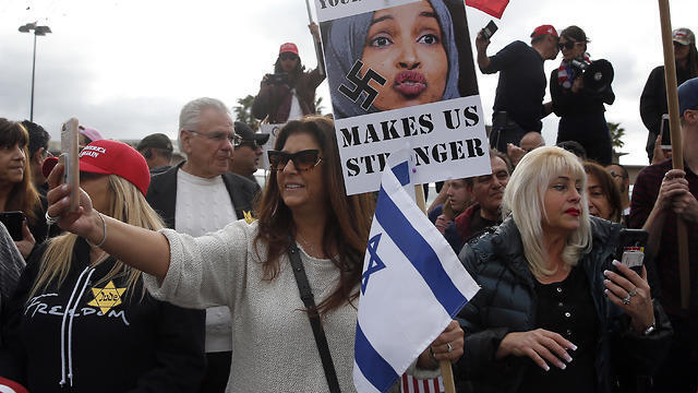 Protesters hold placards and flags during a demonstration against Ilhan Omar, US Representative for Minnesota's 5th congressional district, in Woodland Hills, Los Angelesm California (Photo: EPA) Protesters hold placards and flags during a demonstration against Ilhan Omar, US Representative for Minnesota's 5th congressional district, in Woodland Hills, Los Angelesm California