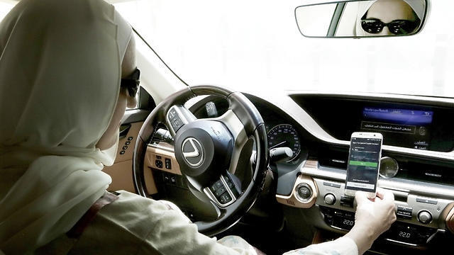 Ammal Farahat, who has signed up to be a driver for Careem, a regional ride-hailing service that is a competitor to Uber, opens the Careem app on her mobile phone before she starts driving, in Riyadh, Saudi Arabia (Photo: AP) (Uber) Ammal Farahat, who has signed up to be a driver for Careem, a regional ride-hailing service that is a competitor to Uber, opens the Careem app on her mobile phone before she starts driving, in Riyadh, Saudi Arabia (Photo: AP)