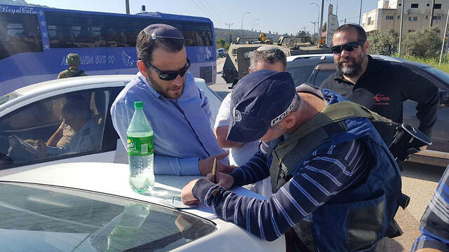 Yehoshua Sherman testifying at the scene of the attack Wednesday