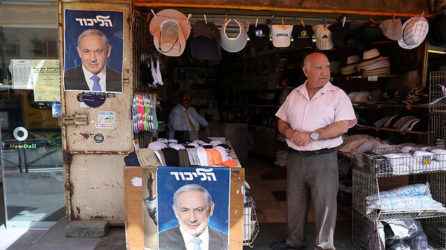 A market stall in Jerusalem with signs supporting the Likud Party