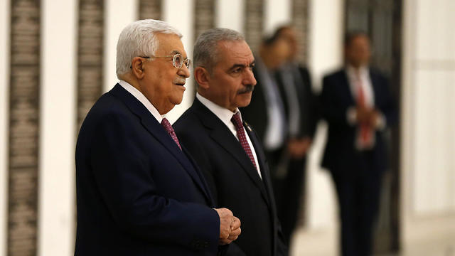 Palestinian President Mahmoud Abbas with Mohammed Shtayyeh