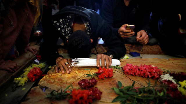A worshipper prays in the Church of the Holy Sepulchre on Good Friday (Photo: Reuters)