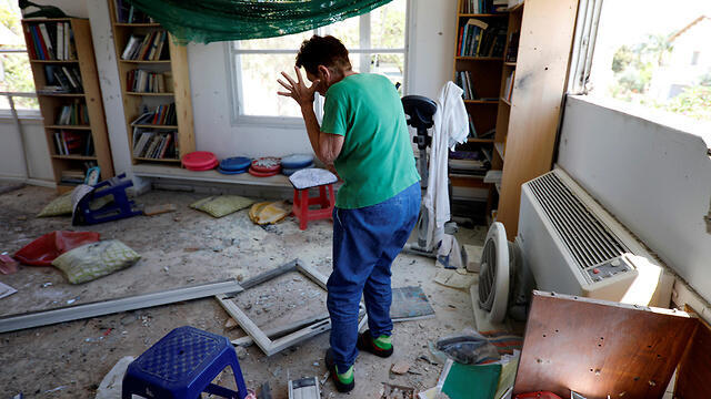 A home in a Gaza border community sustains a direct hit from a rocket 