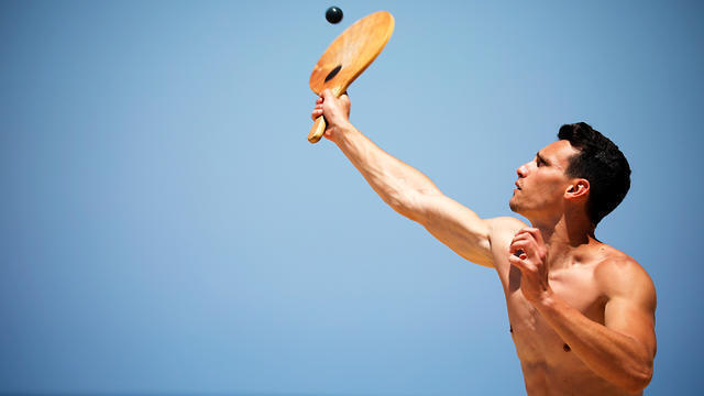 A man plays paddle ball, known in Hebrew as "matkot", a popular Israeli sport, at a beach in Israel (Photo: Reuters) A man plays paddle ball, known in Hebrew as "matkot", a popular Israeli sport, at a beach in Israel