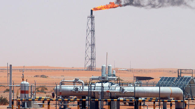An image showing a gas flame behind pipelines in the desert at Khurais oil field, about 160 km from Riyadh, Kingdom of Saudi Arabia (Photo: EPA) An image showing a gas flame behind pipelines in the desert at Khurais oil field, about 160 km from Riyadh, Kingdom of Saudi Arabia