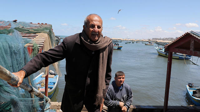 Palestinian fisherman Mahmoud Al-Assi, 73, who said that he was expelled with his family from Jafa when Israel was founded in 1948, walks at the seaport of Gaza City (Photos: Reuters) Palestinian fisherman Mahmoud Al-Assi, 73, who said that he was expelled with his family from Jafa when Israel was founded in 1948, walks at the seaport of Gaza City