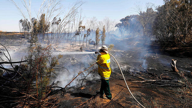 Firefighters put out a blaze in Kibbutz Nahal Oz in southern Israel 