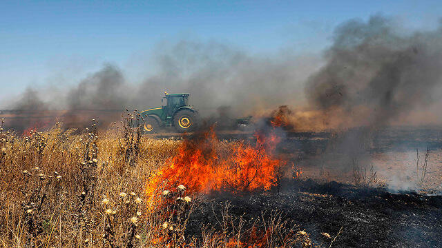 Fire started by incendiary balloons in Israeli community bordering Gaza 