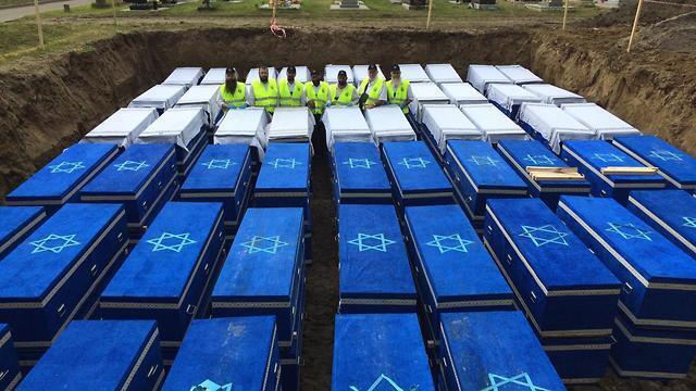 ZAKA delegation in front of remains of Holocaust victims