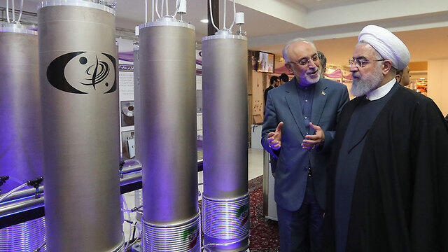 Iranian President Hassan Rouhani at one of his country's nuclear facilities (צילום: AFP) Iranian President Hassan Rouhani at one of his country's nuclear facilities