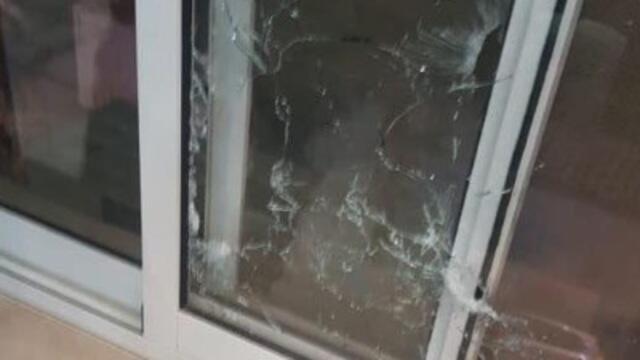 Bullet holes along the windows of the HQ building  