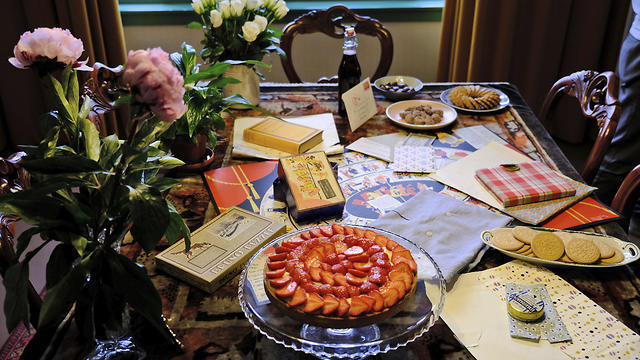 A table is decorated with replicas of gifts Anne Frank received for her 13th birthday - including her first diary - during an event at her family's former apartment in Amsterdam to mark what would have been the teenage Jewish diarist's 90th birthday June 12, 2019