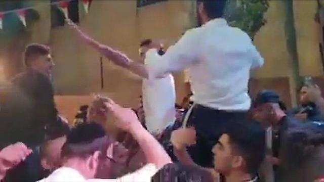 Israeli settlers participating in Palestinian wedding 