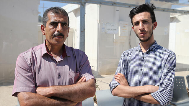 Anwar and Qusay Katusa, the brother and father of rape suspect Mahmoud Katusa, outside Ofer Military Court in the West Bank on Wednesday (צילום: עמית שאבי) Anwar and Qusay Katusa, the brother and father of rape suspect Mahmoud Katusa, outside Ofer Military Court in the West Bank on Wednesday