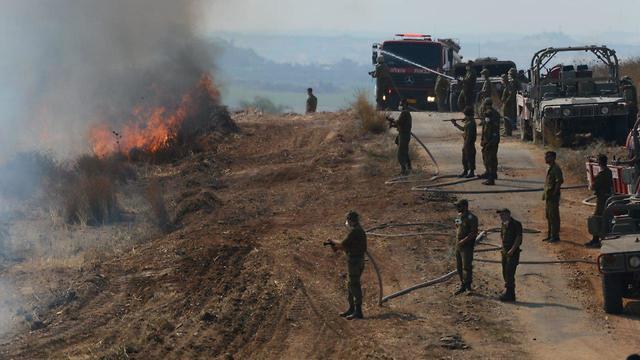 IDF troops help battle the fires