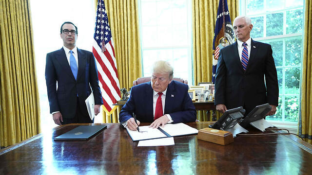 Donald Trump signing new sanctions on Iran in June