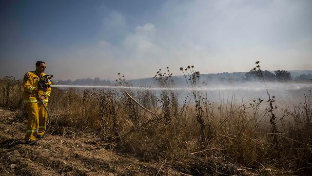 Firefighter battles a blaze in Gaza border region 