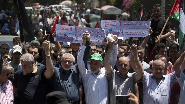 Hamas heads Ismail Haniyeh and Yahya Sinwar attend Gaza Strip protest against Bahrain summit