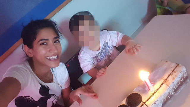 Carmel Mauda with one of the children