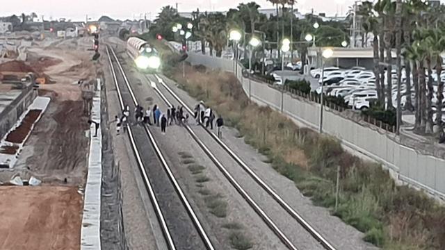 Protesters blcok train tracks in Ashkelon