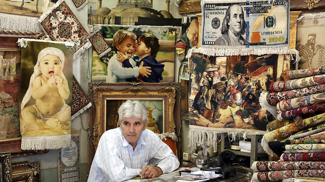 Iranian murchant in his shop (Photo: AP)