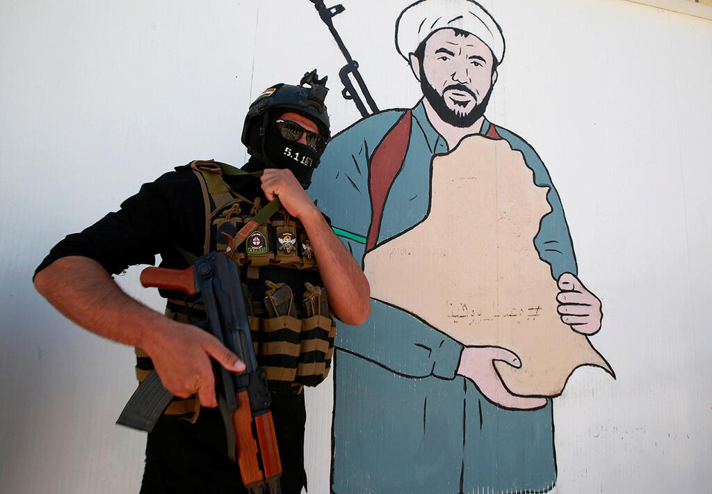 Najaf, Iraq: Popular Mobilization Forces (PMF) fighter (Photo: Reuters) נג'ף עיראק עיראק אל-חשד א-שעבי PMF מיליציות שיעיות הגיוס העממי