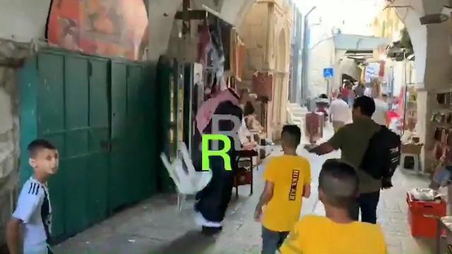Chairs are thrown at Mohammed Saud in the Old City of Jerusalemnullnull Chairs are thrown at Mohammed Saud in the Old City of Jerusalem