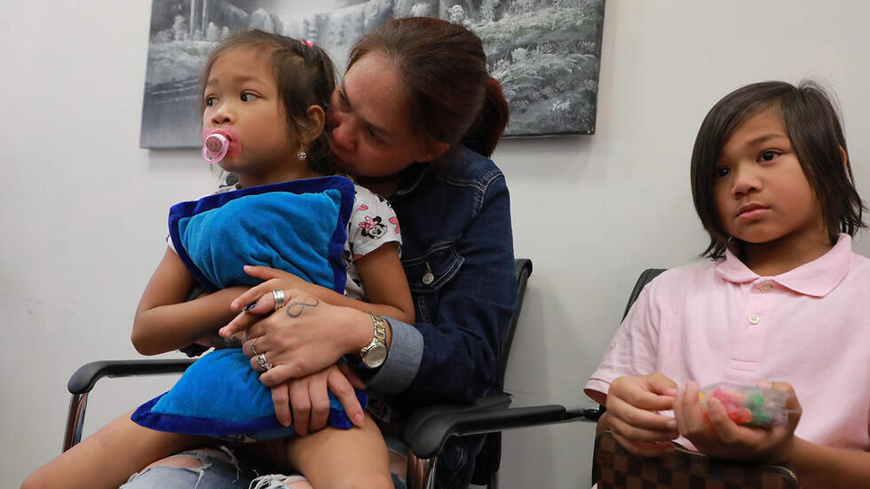Geraldine Esta and her children in court in Tel Aviv on Tuesday