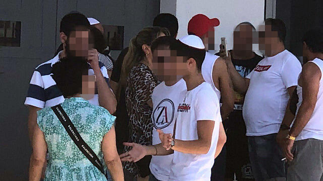 One of the teens with his family after release from jail