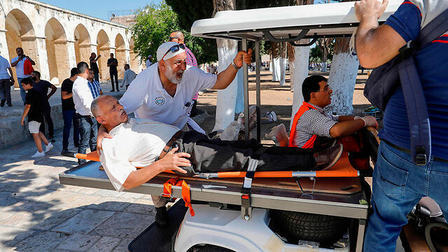 A Muslim worshipper is wounded during clashes with police on Temple Mount, August 11, 2019
