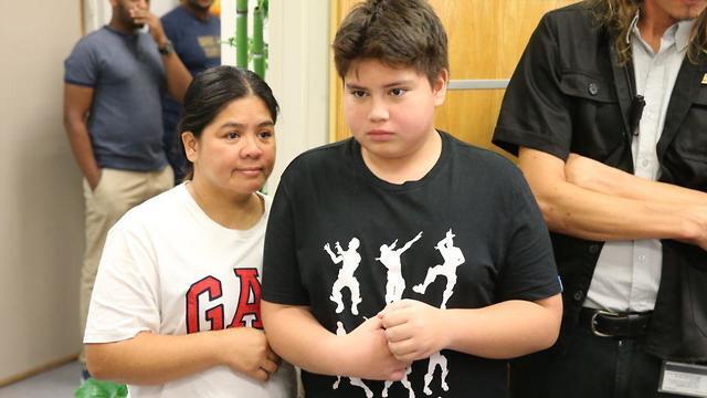 Rohan Perez and his mother, Rosemarie, in court