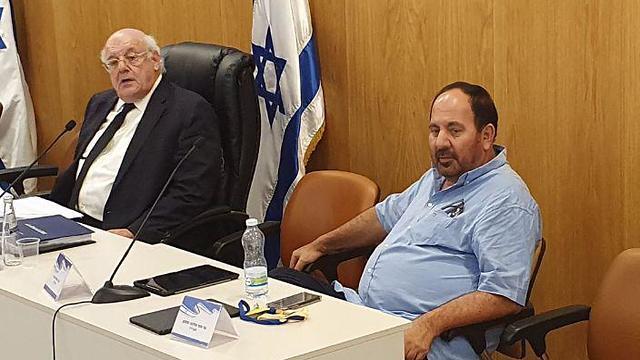 Sami Shoshan, left, and CEC head Justice Hanan Melcer