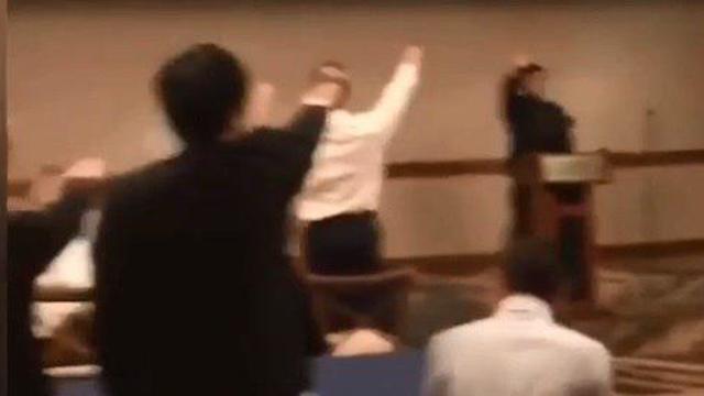 Students giving a Hitler salute during the ceremony