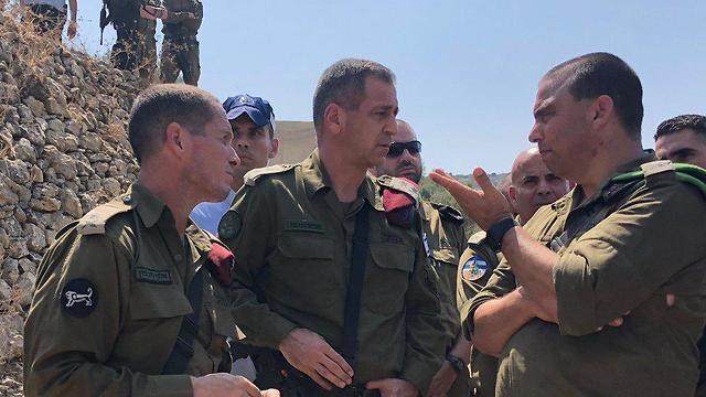 IDF Chief of Staff,Aviv Kochavi, center, at the site of the deadly terror attack