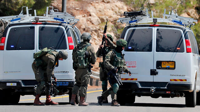 Security forces at the scene of the attack