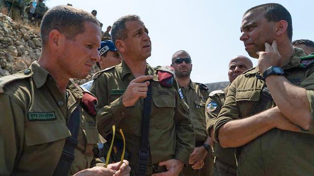 IDF Chief of Staff,Aviv Kochavi, center, at the site of the deadly terror attack