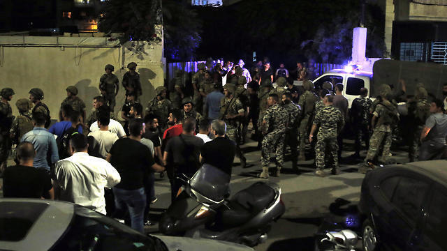 Lebanese security forces at the site where an Israeli drone reportedly crashed