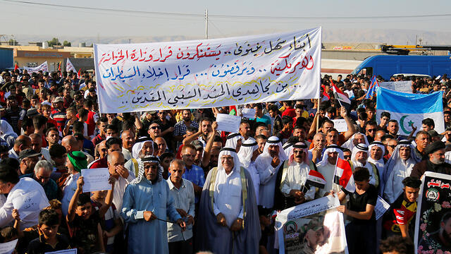 Militias protest against the order to leave their checkpoints in Mosul, July 2019 (צילום: רויטרס) Militias protest against the order to leave their checkpoints in Mosul, July 2019