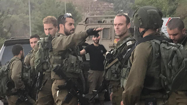 GOC Northern Command Amir Baram, center, on the northern border